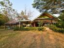 Spacious outdoor view with green surroundings and covered structures