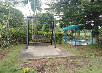 Outdoor garden area with swing and gazebo