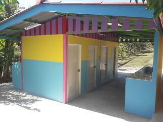 Colorful outdoor facility with individual rooms