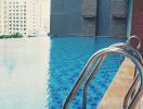 Modern rooftop infinity pool with city view