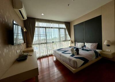 Bedroom with large window and modern furnishings