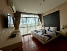 Bedroom with large window and modern furnishings