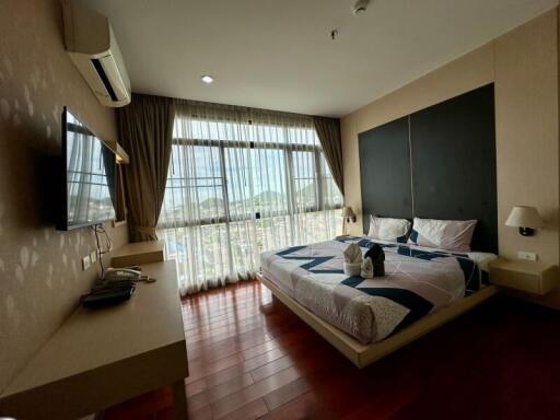 Bedroom with large window and modern furnishings