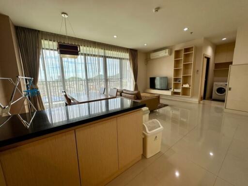 Living area with a view, modern furnishings, and a connected kitchen