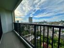 Balcony view with railings overlooking the cityscape