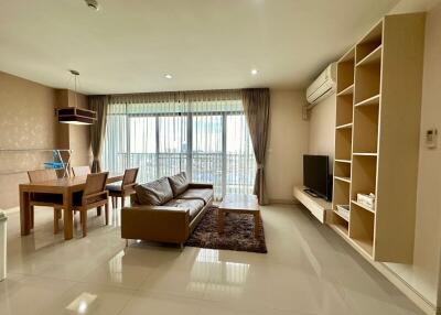 Modern living room with dining area providing ample natural light