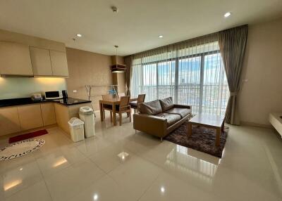 Living room with open kitchen and dining area