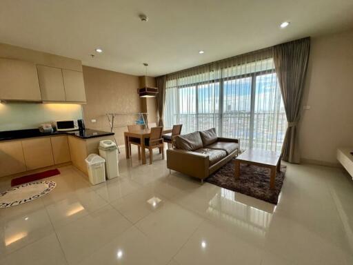 Living room with open kitchen and dining area