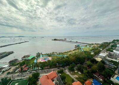 View from building overlooking the sea with a picturesque coastline and distant horizon