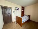 Simple bedroom with wooden furnishings and natural light