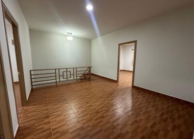 Spacious living room with tiled floors and bright lighting