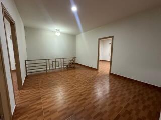 Spacious living room with tiled floors and bright lighting