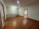 Spacious living room with tiled floors and bright lighting