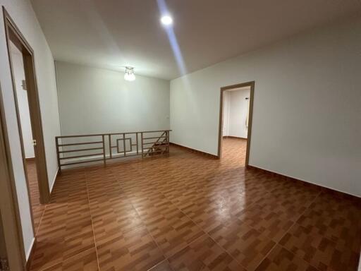 Spacious living room with tiled floors and bright lighting