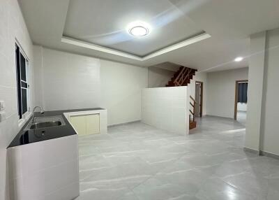 Modern kitchen with staircase in a residential property