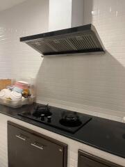 Modern kitchen with stovetop and range hood