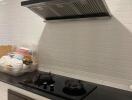 Modern kitchen with stovetop and range hood