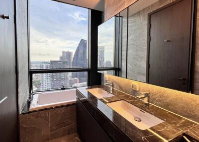 Modern bathroom with city view from the window