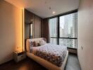 Modern bedroom with large windows and city view