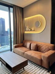 Modern living room with brown leather sofa and wall-mounted shelf, featuring city view from a high-rise building