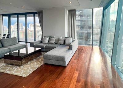 Modern living room with large windows and city view