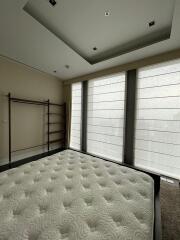 Spacious bedroom with large windows