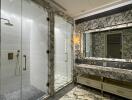 Luxurious bathroom with marble decor and glass shower stalls