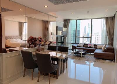 Modern living and dining area with city view