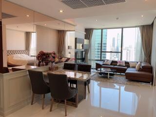 Modern living and dining area with city view