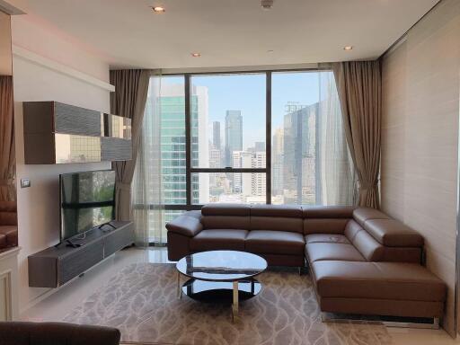 modern living room with floor-to-ceiling windows and city view