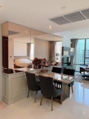 Modern open-plan living and dining area with a view of the bedroom