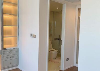 View of modern bathroom entrance with wood flooring