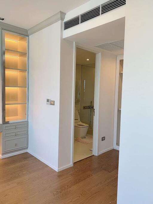 View of modern bathroom entrance with wood flooring