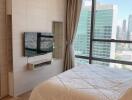 Modern bedroom with a large window and city view