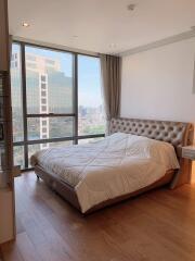 Spacious bedroom with city view