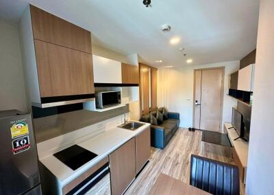 Modern kitchen and living area in a sleek apartment