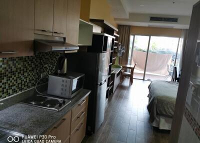 Studio apartment with kitchen and bed area