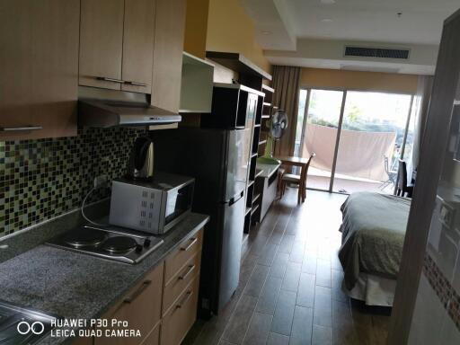 Studio apartment with kitchen and bed area