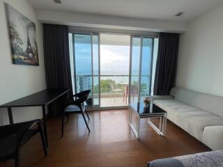 Living area with balcony and ocean view