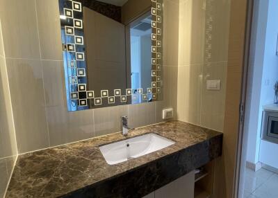 Modern bathroom with large mirror and marble countertop