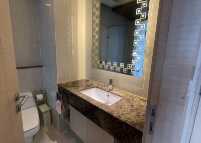 Modern bathroom with large mirror and vanity