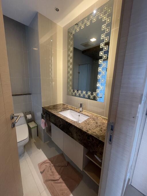 Modern bathroom with large mirror and vanity