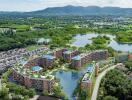 Aerial view of a modern residential complex with surrounding greenery and lakes