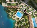 Aerial view of a modern apartment complex with outdoor swimming pools and lush greenery