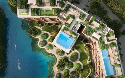 Aerial view of a modern apartment complex with outdoor swimming pools and lush greenery