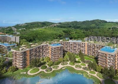 Aerial view of modern residential complex with surrounding greenery