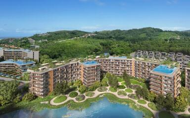 Aerial view of modern residential complex with surrounding greenery