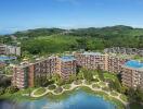 Aerial view of modern residential complex with surrounding greenery