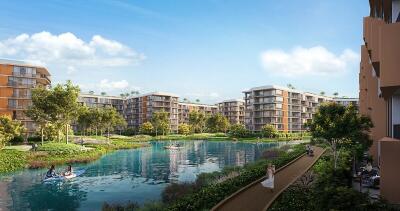 Scenic view of a residential complex with a central water feature and lush greenery