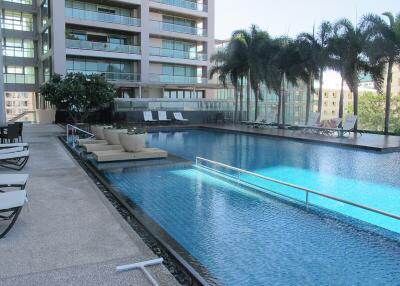 modern apartment complex with swimming pool